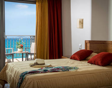 Ariadne Hotel Malia Luxury Studio decorated double bed and balcony view