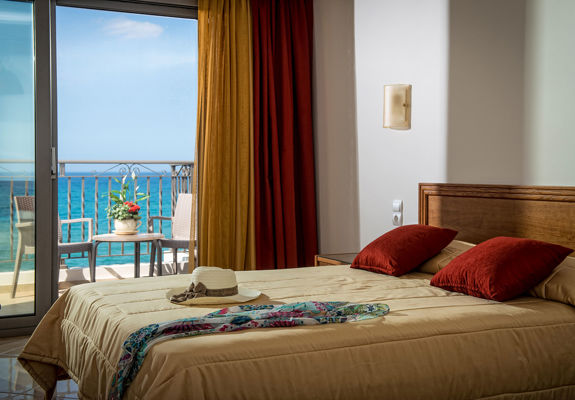 Ariadne Hotel Malia Luxury Studio decorated double bed and balcony view