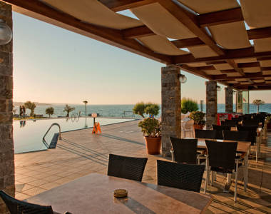 Ariadne Hotel Malia bar sitting area with pool view