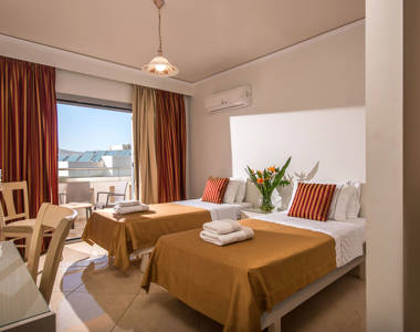 Ariadne Hotel Malia Family Room twin beds, balcony view and amenities